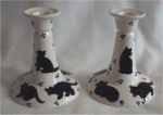 Pair of black and white cat candlesticks