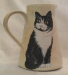 Character cat jug with 4 cats