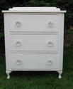 A classic-shaped bedside cabinet with glass knobs - SOLD